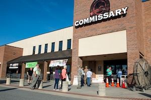 Photo of Moody Airmen checking IDs in front of the commissary.