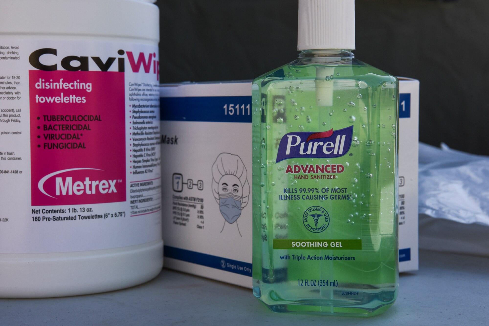 Disinfecting and protective materials sit on a table at the clinic outside of a COVID-19 screening tent at Kunsan Air Base, Republic of Korea, March 19, 2020. The 8th Medical Group took proactive and precautionary measures amid the COVID-19 pandemic by standing up a screening tent outside of the clinic for service members who have recently returned to Kunsan from international travel. (U.S. Air Force photo by Senior Airman Jessica Blair)