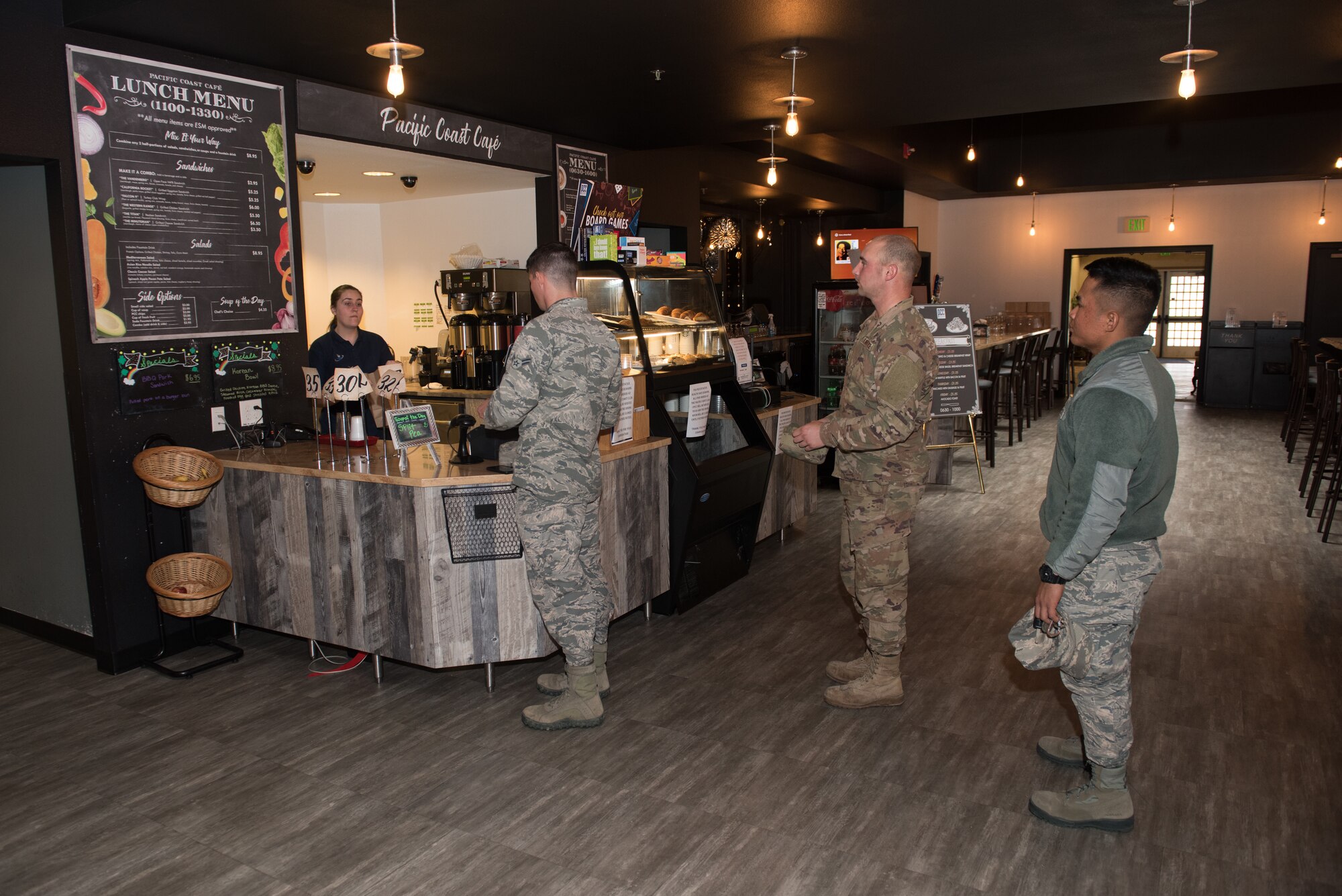 Photo of airmen waiting in line inside the Pacific Coast Club.