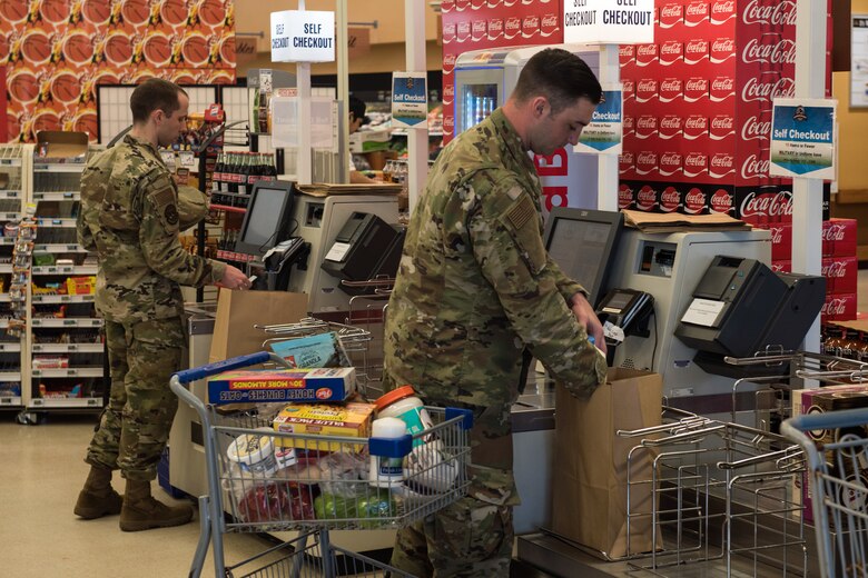 Photo of airmen shopping at Commissary