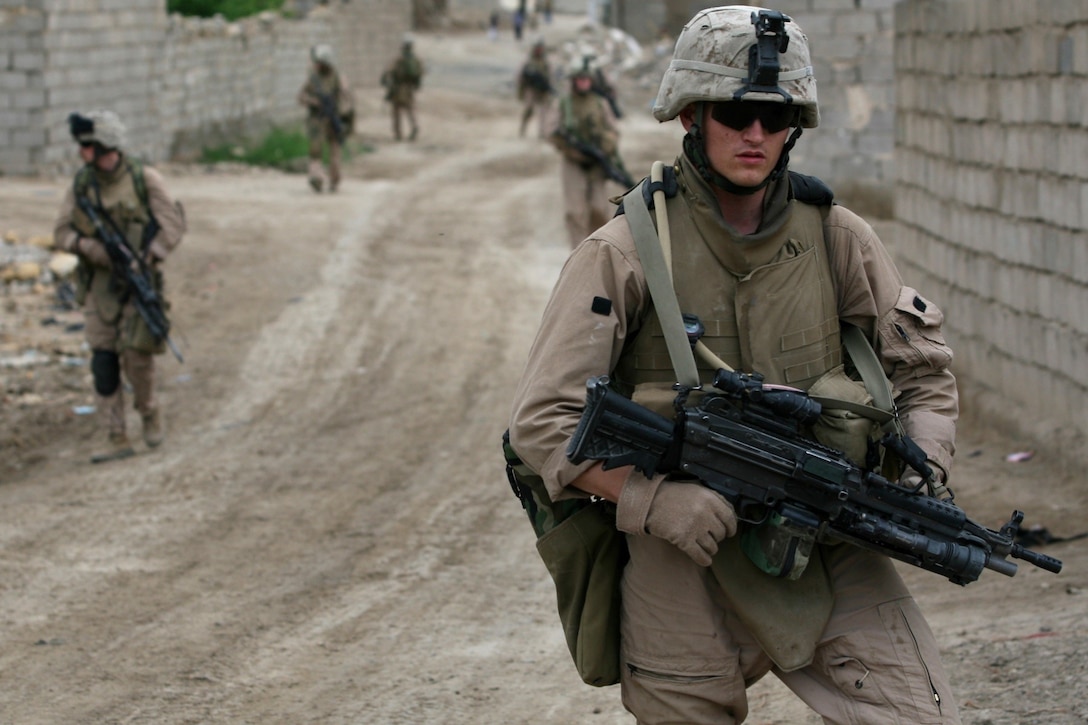 SAQLAWIYAH, Iraq - Marines with 2nd squad, 2nd platoon return to forward operating base Riviera after a patrol on April 28, 2007. The Marines of Fox Company, 2nd Battalion, 7th Marine Regiment conduct security patrols to monitor and prevent possible anti-coalition force attacks. Regimental Combat Team 6 is deployed with Multi National Forces-West in support of Operation Iraqi Freedom in the Al Anbar province of Iraq to develop Iraqi Security Forces, facilitate the development of official rule of law through democratic reforms, and continue the development of a market based economy centered on Iraqi reconstruction. (U.S. Marine Corps photo by Cpl. Neill A. Sevelius) (Released)