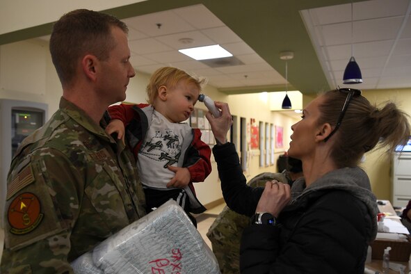 Providers at the 30th Force Support Squadron Child Development Center check the temperature of children and parents March 19, 2020, at Vandenberg Air Force Base, Calif.