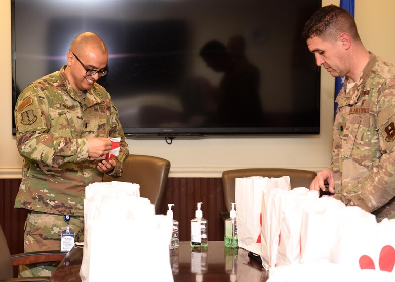 U.S. Air Force staff from the 17th Medical Group receive lunch donated by San Angelo community partners at the Ross Clinic on Goodfellow Air Force Base, Texas, March 20, 2020. Medical members were experiencing an influx of patients during the COVID-19 pandemic. Goodfellow currently has no confirmed COVID-19 cases. (U.S. Air Force photo by Airman 1st Class Abbey Rieves)