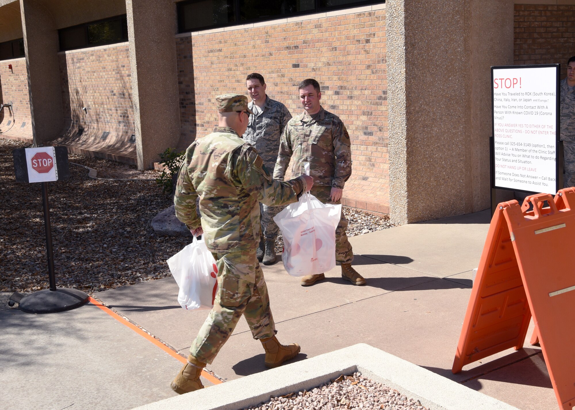U.S. Air Force Col. Robert Ramirez, 17th Training Wing vice commander, is pre-screened before entering the Ross Clinic with lunch donated by San Angelo community partners for the 17th Medical Group’s staff on Goodfellow Air Force Base, Texas, March 20, 2020. With Goodfellow’s Health Protection Condition (HPCON) in BRAVO, all patients entering the clinic are asked if they exhibit symptoms related to the COVID-19 pandemic. Goodfellow currently has no confirmed COVID-19 cases. (U.S. Air Force photo by Airman 1st Class Abbey Rieves)