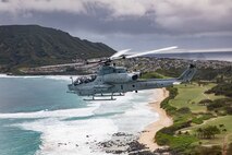 A U.S. Marine Corps AH-1Z Viper helicopter with Marine Light Attack Helicopter Squadron 367, Marine Aircraft Group 24, flies from Marine Corps Air Station Kaneohe Bay to Joint Base Pearl Harbor-Hickam, Hawaii, March 13, 2020.