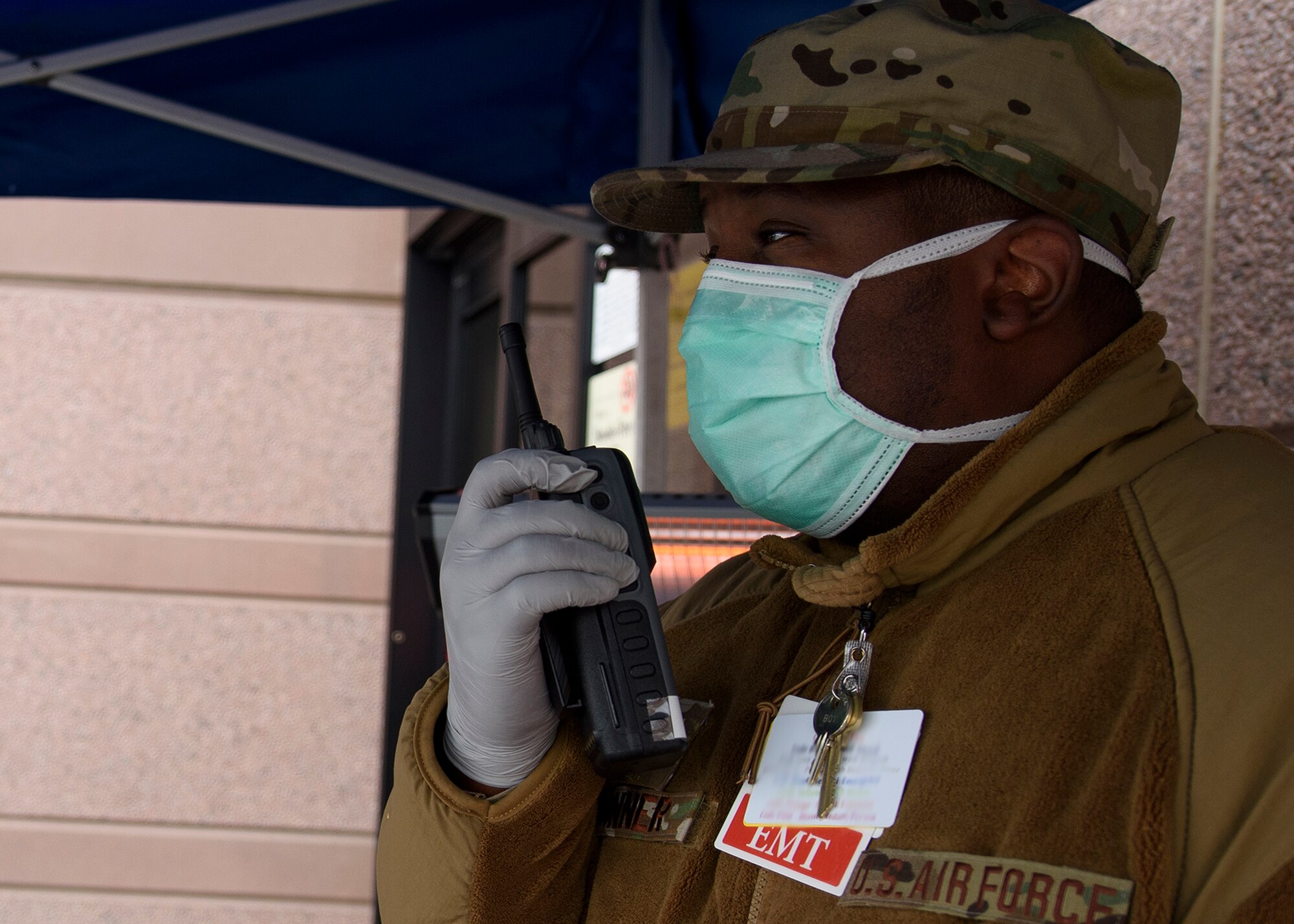 An Airman speaks into a radio.