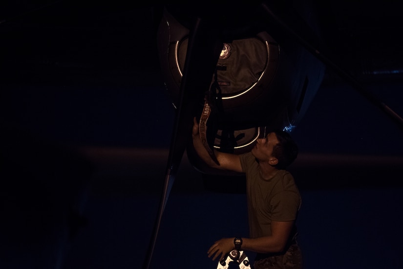 Senior Airman Tanner Huff, 39th Airlift Squadron loadmaster assigned to Dyess Air Force Base, Tx., performs post-flight checks on a C-130 Hercules at Joint Base Charleston, S.C., March 20, 2020.