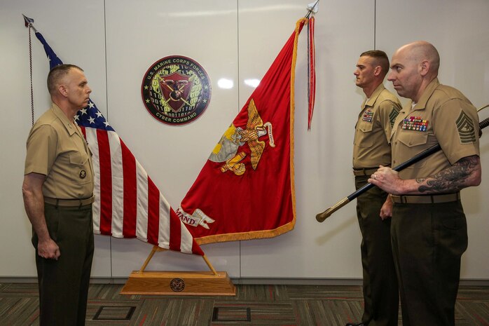 Maj. Gen. Matthew G. Glavy, Marine Corps Forces Cyberspace Command and Joint Task Force Ares commander, presides over a relief and appointment ceremony in Lasswell Hall, Fort Meade, Maryland, Mar. 19, 2020. During the ceremony, Sgt. Maj. Daniel L. Krause relinquished his duties as the sergeant major of MARFORCYBER while Sgt. Maj. Jay D. Williamson was appointed to fill the role. (Department of Defense photo by Joseph Wilbanks)