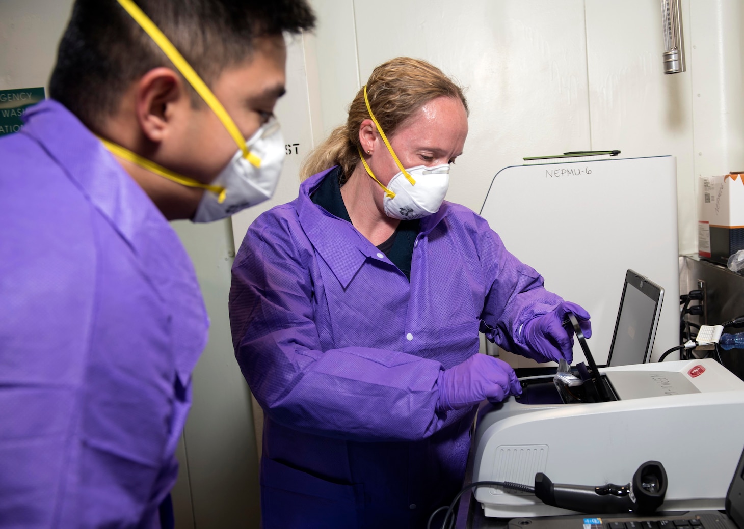 SOUTH CHINA SEA – (March 14, 2020) Members of the Navy’s preventative medicine team Lt. Cmdr. Rebecca Pavlicek, and Hospital Corpsman Gian Molina, both assigned to Navy Environmental Preventative Medicine Unit Six, test samples in a BioFire Film Array, which will test for nearly 30 different diseases, aboard the U.S. 7th Fleet flagship USS Blue Ridge (LCC 19). To date, no cases of COVID-19 have been detected aboard any 7th Fleet U.S. Navy vessels, but if a case were to arise, ships have isolation plans in place to contain the infection. As the U.S. Navy's largest forward-deployed fleet, 7th Fleet operates roughly 50-70 ships and submarines and 140 aircraft with approximately 20,000 Sailors.