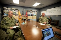 Joint Task Force Civil Support (JTF-CS) Commanding General Army Maj. Gen. William “Bill” Hall, Command Senior Enlisted Leader Chief Master Sgt. James Brown and JTF-CS Surgeon General Navy Capt. Bryan Schumaker host a virtual town hall meeting in the command’s conference room.