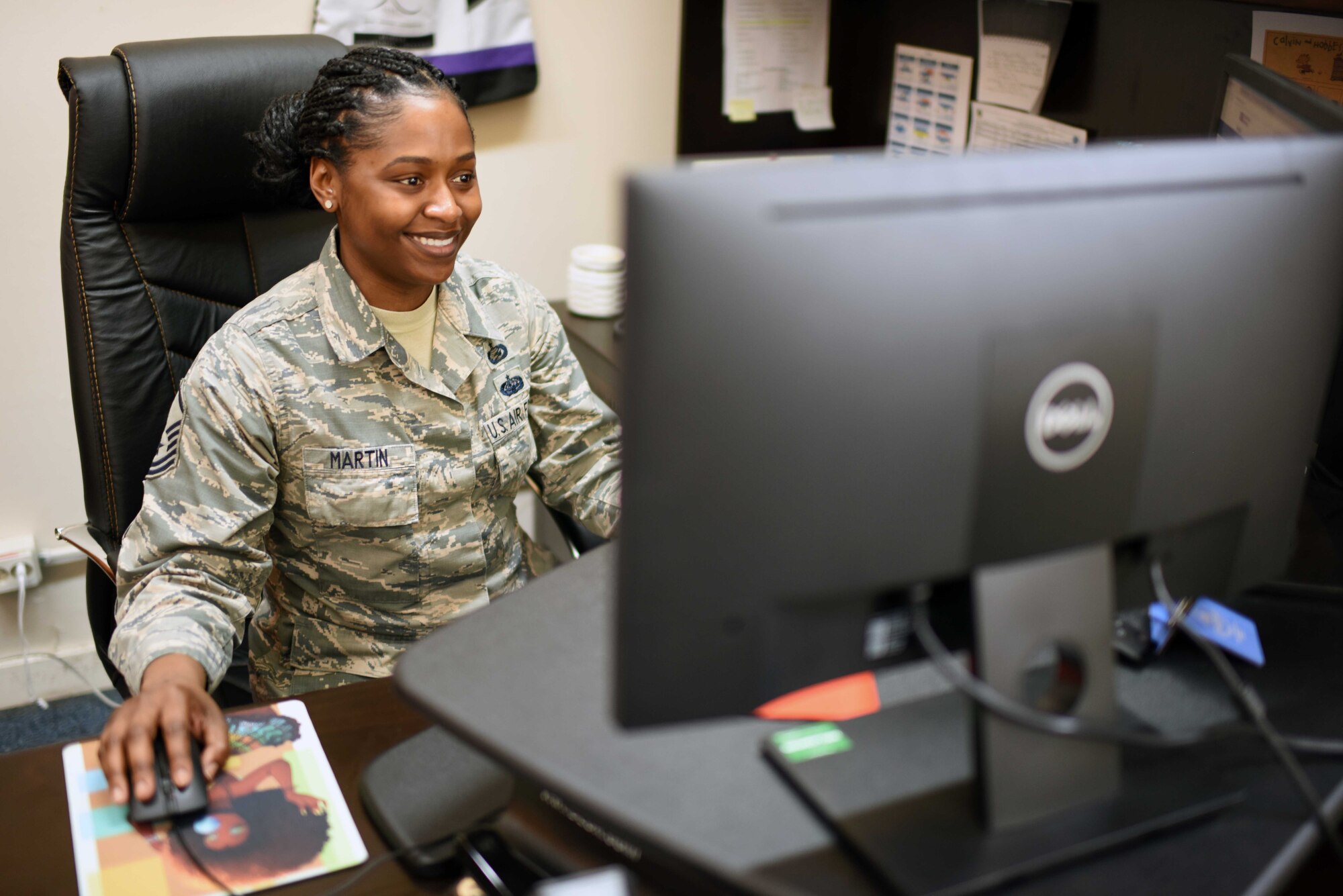 U.S. Air Force Master Sgt. Ashley Martin, 39th Air Base Wing Equal Opportunity director, works at her desk, March 11, 2020, at Incirlik Air Base, Turkey. During her 13 years of service, Martin gives back to fellow Airmen by ensuring organizations conduct their affairs free from unlawful discrimination and sexual harassment. (U.S. Air Force photo by Tech. Sgt. Jim Araos)