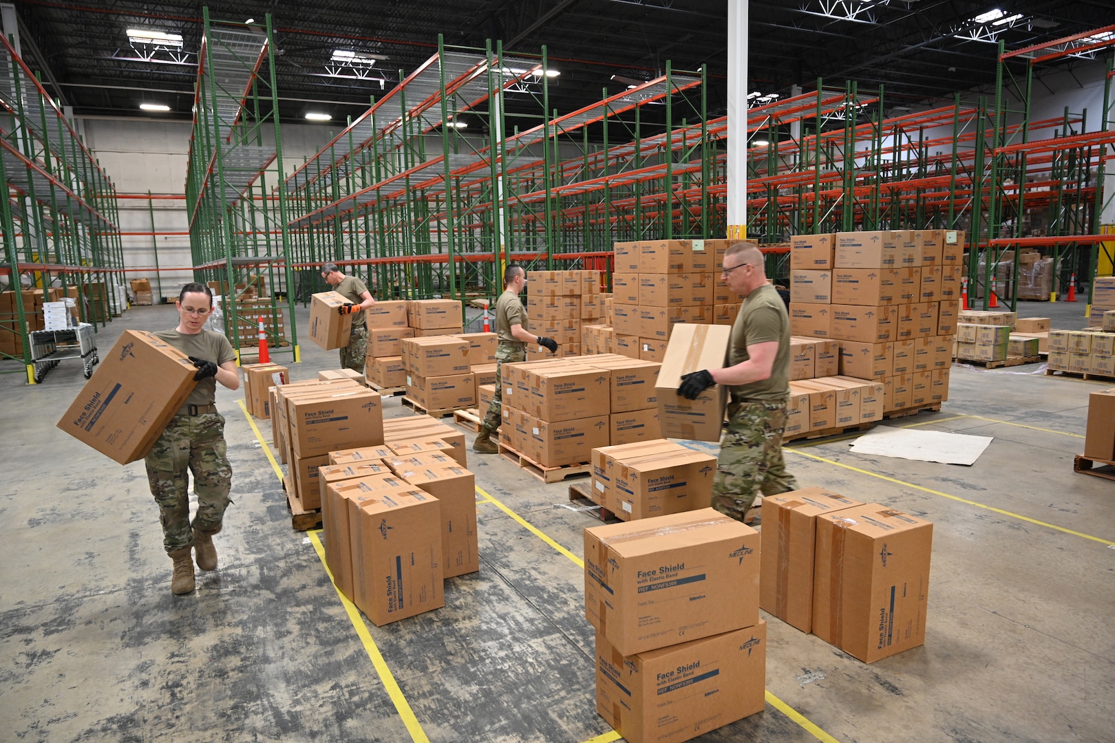 Members of the Maryland Air National Guard 175th Logistics Readiness Squadron work with members of the Maryland Office of Preparedness and Response March 19, 2020, to prepare and load medical supplies and equipment at the Maryland Strategic National Stockpile. All assets provided were prioritized for health care workers and hospitals in response to the COVID-19 pandemic.