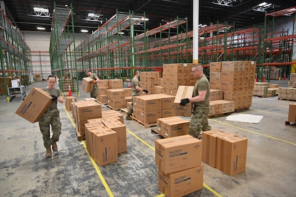 Members of the Maryland Air National Guard 175th Logistics Readiness Squadron work with members of the Maryland Office of Preparedness and Response March 19, 2020, to prepare and load medical supplies and equipment at the Maryland Strategic National Stockpile. All assets provided were prioritized for health care workers and hospitals in response to the COVID-19 pandemic.