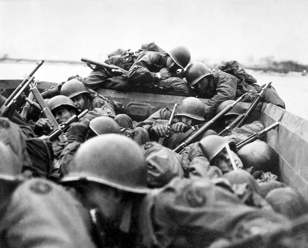 Troops in boats hunker down.