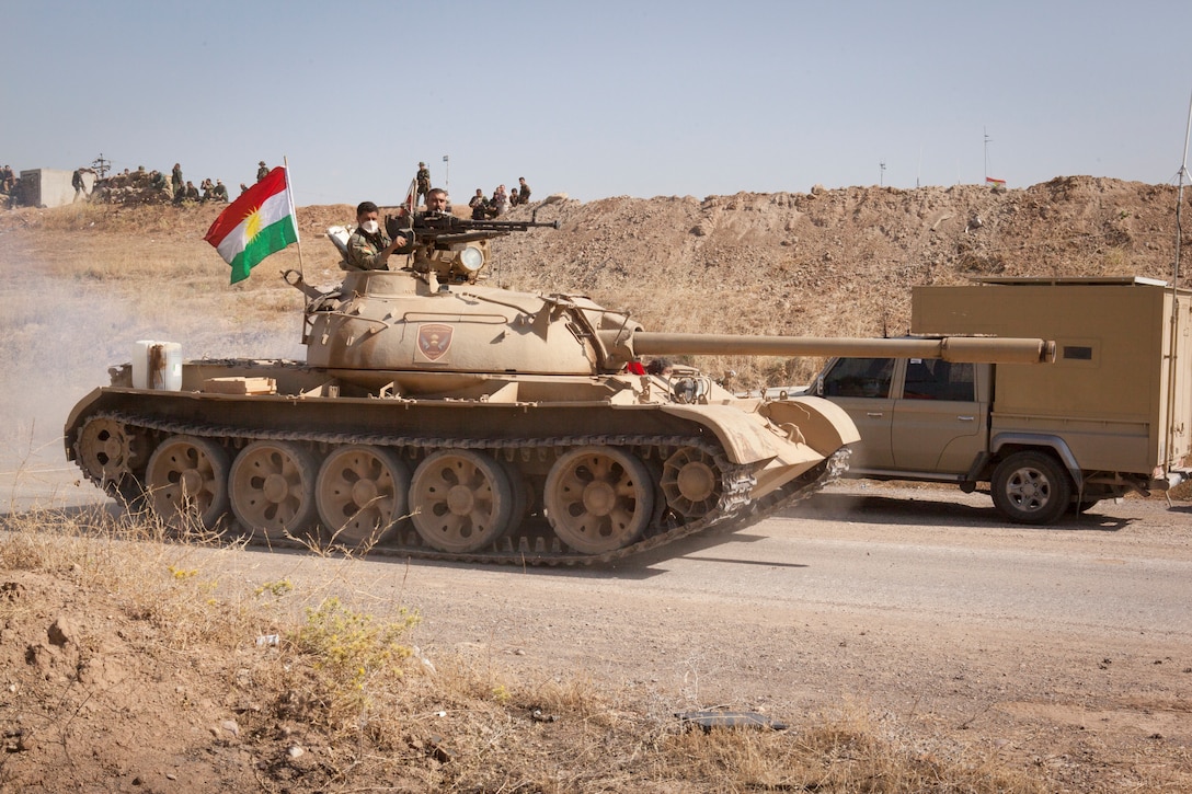 Peshmerga soldiers, part of the Kurdistan Regional Government’s security forces supporting the Iraqi security forces, operate a tank at a security outpost toward the Combined Joint Task Force – Operation Inherent Resolve forward line of troops in Erbil Province, Iraq, May 29, 2016. The Peshmerga have coordinated with the Iraqi security forces and Coalition partners to assist in the regional removal of Da’esh. CJTF – OIR aims to enable and equip indigenous forces to take ISIL head on while leveraging U.S. and Coalition nation airpower to halt the terrorist’s momentum. (U.S. Army photo by Staff Sgt. Sergio Rangel/RELEASED)