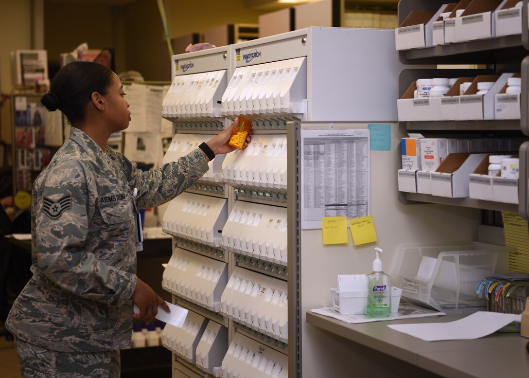 U.S. Air Force Staff Sgt. Montea Armstrong, 17th Medical Group pharmacy technician, fills a prescription at the Ross Clinic’s pharmacy on Goodfellow Air Force Base, Texas, March 23, 2020. The 17th MDG activated a drive-in pharmacy to minimize personnel in the clinics and medical staff delivered prescriptions to the patients outside the clinic in their cars. (U.S. Air Force Photo by Airman 1st Class Abbey Rieves)