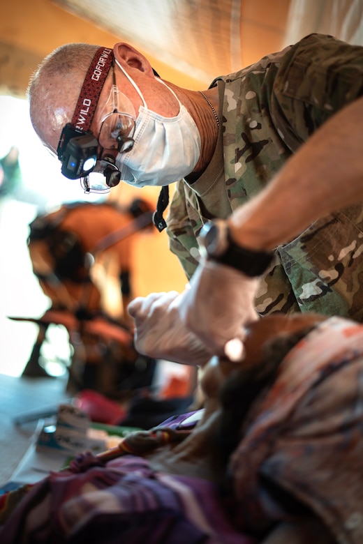 U.S. Army Lt. Col. Steven Marshall, Joint Task Force-Bravo dentist, conducts a dental exam at a medical readiness event as part of Exercise Vita in Tres Bocas, Colombia, March 12, 2020. Exercise Vita brought combined forces together to perform humanitarian and civic-action operations in the La Guajira region of Colombia. Medical readiness exercises prepare participants for future operations while providing key services to communities most in need. (U.S. Army photo by Sgt. Philip Ribas)