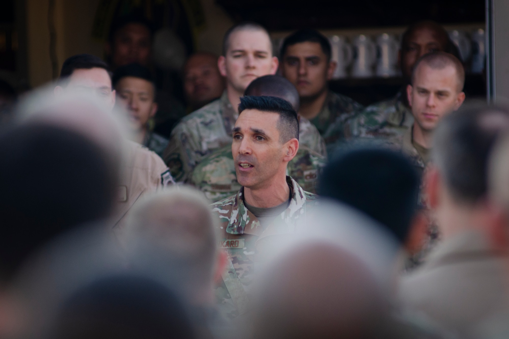 U.S. Air Force Chief Master Sgt. Shawn Drinkard, U.S. Air Forces Central Command command chief, speaks with AFCENT Airmen outside of the combined air operations center at Al Udeid Air Base, Qatar, March 6, 2020.