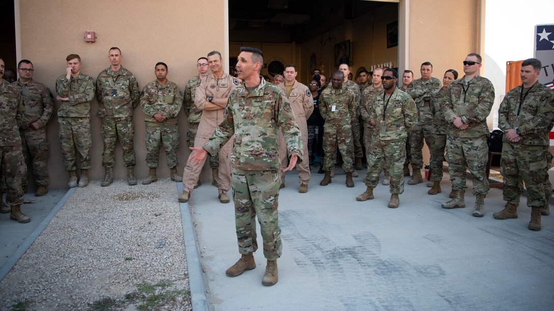 U.S. Air Force Chief Master Sgt. Shawn Drinkard, U.S. Air Forces Central Command command chief, speaks with AFCENT Airmen outside of the combined air operations center at Al Udeid Air Base, Qatar, March 6, 2020.