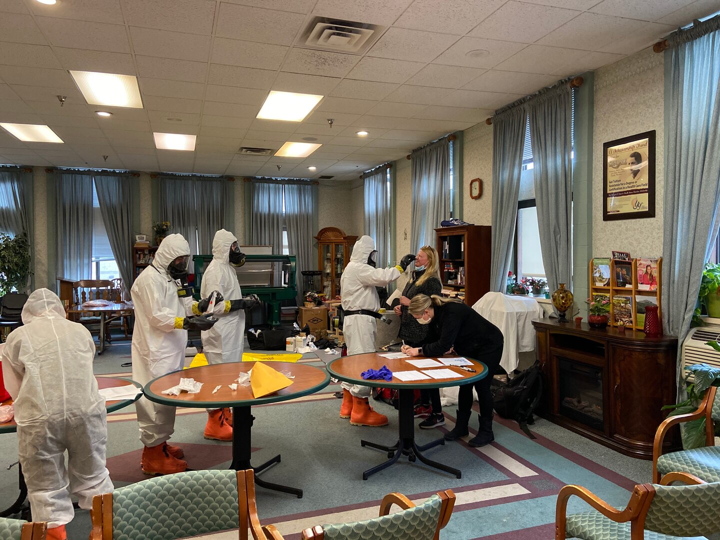 Members of the West Virginia National Guard's Chemical, Biological, Radiological, Nuclear and High Yield Explosive (CBRNE) Battalion and 35th Civil Support Team (CST) help test the staff of a nursing facility March 23, 2020, in Morgantown, West Virginia.