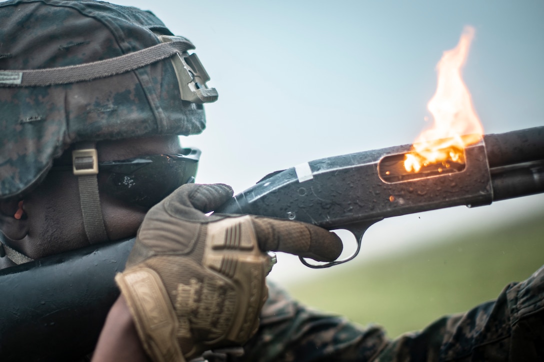 A U.S. Marine fires a Mossberg 500 12-gauge shotgun during a non-lethal weapons course at Marine Corps Base Camp Pendleton, Calif., March 12.