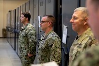 JOINT BASE LANGLEY-EUSTIS, Va. (March 23, 2020) Navy Logistics Specialist 1st Class Zachary Smith, center, is promoted by Joint Task Force Civil Support Commanding General Maj. Gen. William “Bill” Hall during a ceremony in the command’s mobility center.