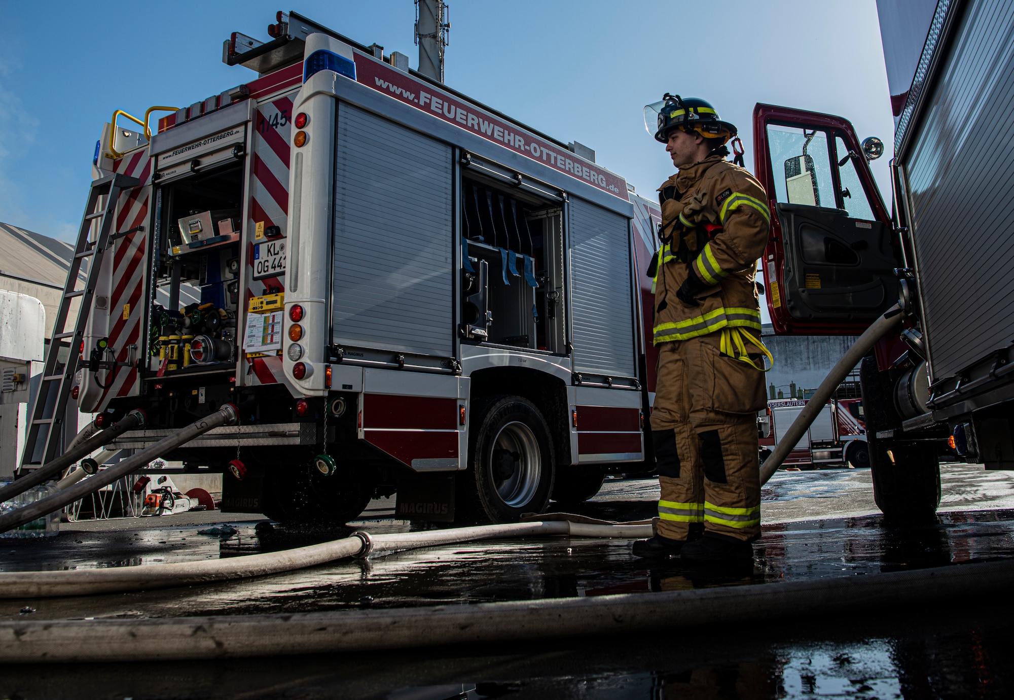U.S. Air Force Airman 1st Class Jackson Bird, 86th Civil Engineer Squadron Fire and Emergencies firefighter, supervises the transfer of water from Ramstein Air Base’s fire truck to the German fire truck in Otterberg, Germany, March 23, 2020.