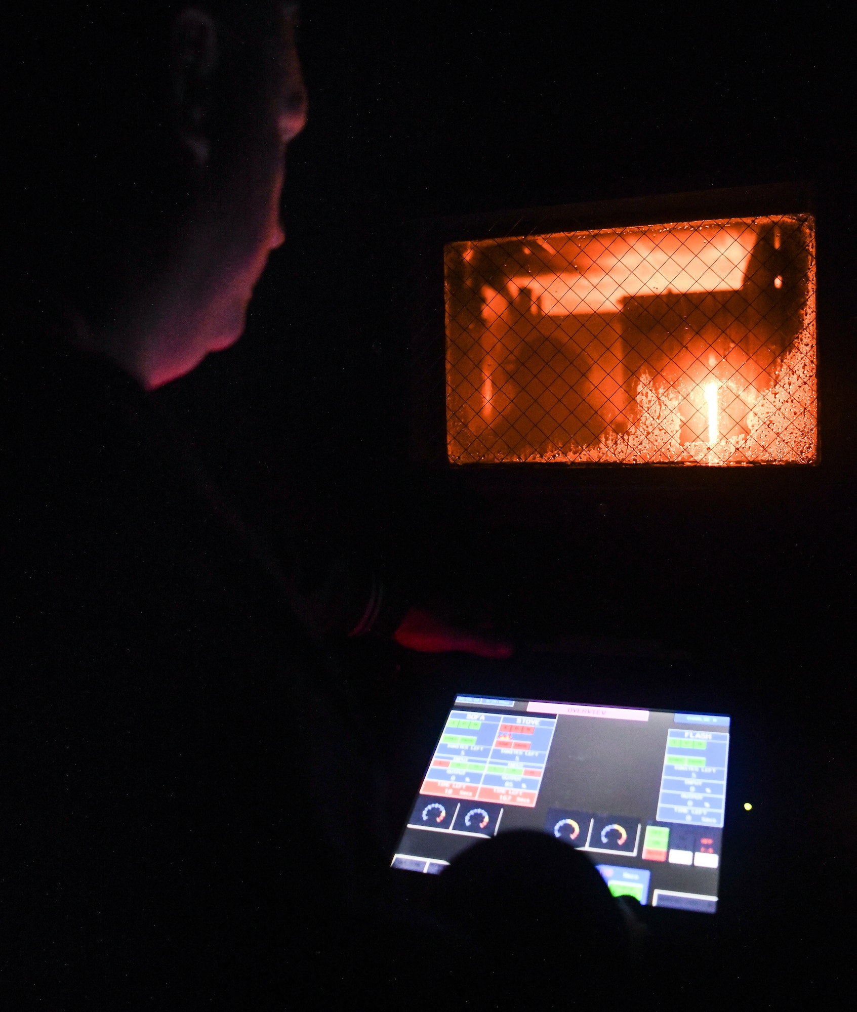 Charles Rafferty with the Kentucky State Fire Commission operates the live fire training simulator, Feb. 25, 2020, at Arnold Air Force Base, Tenn. Arnold AFB Fire and Emergency Services has worked with the Kentucky Community and Technical College System, which includes the Kentucky State Fire Commission, for the past several years for live fire training using the Commission's simulator. (U.S. Air Force photo by Jill Pickett)