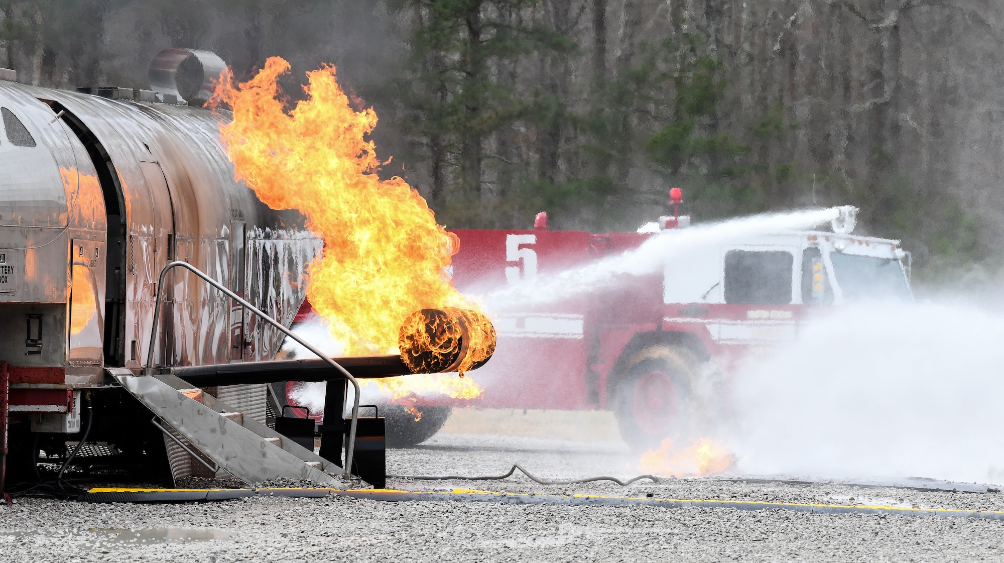 Arnold Air Force Base Fire and Emergency Services personnel use the roof turret on an aircraft firefighting vehicle to battle a blaze while training, March 5, 2020, on aircraft rescue and firefighting techniques at the fire crew’s training area on base. (U.S. Air Force photo by Jill Pickett)