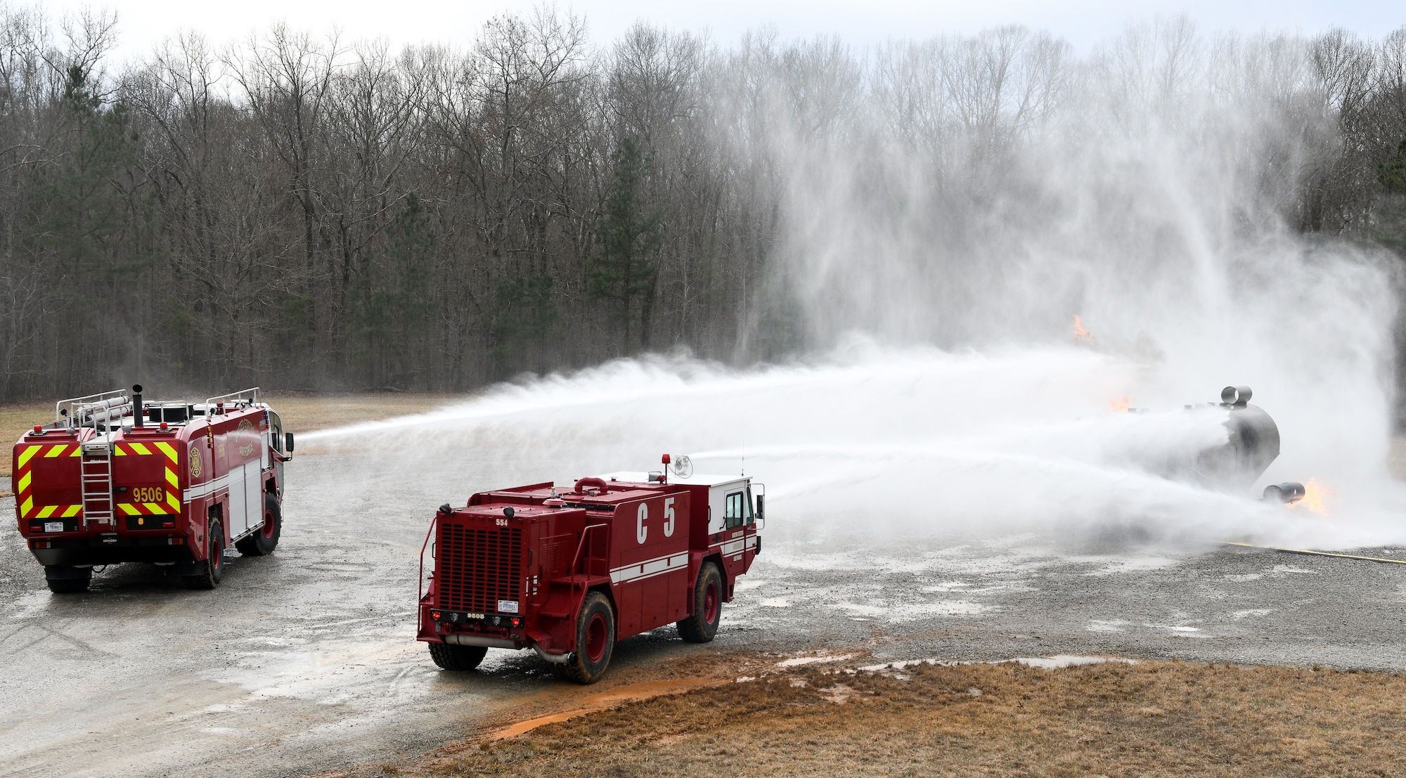 Arnold Air Force Base Fire and Emergency Services personnel attack a fire using vehicle-mounted nozzles while training March 5, 2020, on aircraft rescue and firefighting techniques at a training area on base. (U.S. Air Force photo by Jill Pickett)