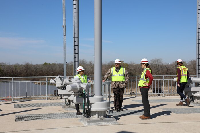 USACE water control managers and civil engineers at the Galveston District with the Houston Project Office inspect an operator on the new water control structures at Barker Dam. The new structures were placed into use on Feb. 14 as part of a multi-year, $75 million dam safety contract that will improve the robustness, redundancies and resiliency of both Addicks and Barker dams and reservoirs.