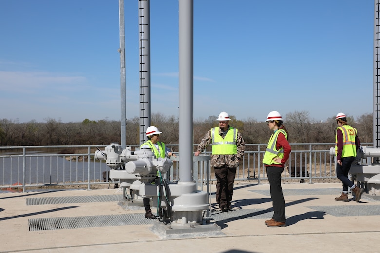 USACE water control managers and civil engineers at the Galveston District with the Houston Project Office inspect an operator on the new water control structures at Barker Dam. The new structures were placed into use on Feb. 14 as part of a multi-year, $75 million dam safety contract that will improve the robustness, redundancies and resiliency of both Addicks and Barker dams and reservoirs.