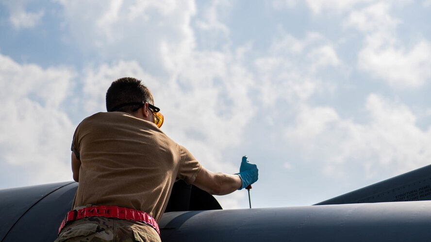 Airman 1st Class Jean Labesque, 2nd Aircraft Maintenance assistant dedicated crew chief performs maintenance on a B-52H Stratofortress at Barksdale Air Force Base, La., March 19, 2020. It’s the responsibility of Barksdale’s crew chiefs to coordinate all necessary maintenance in order to keep the aircraft in war fighting form. (U.S. Air Force photo by Airman 1st Class Jacob B. Wrightsman)