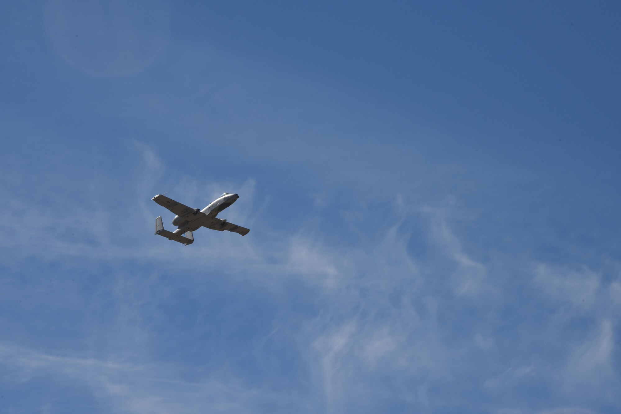 A photo of an A-10 flying over DM