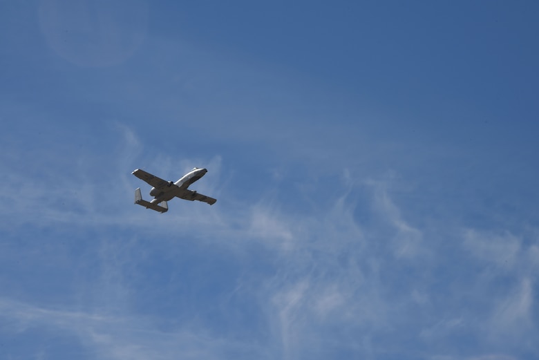 A photo of an A-10 flying over DM