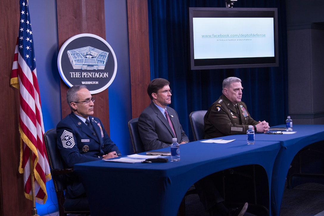 Senior Enlisted Advisor to the Chairman Ramon “CZ” Colon-Lopez, Defense Secretary Dr. Mark T. Esper and Army Gen. Mark A. Milley sit at a table.
