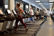 Airmen assigned to the 354th Fighter Wing run on treadmills in the Baker Fieldhouse on Eielson Air Force Base, Alaska, March 21, 2020. In light of the Department of Defense policy prohibiting group physical training the wing is enforcing social distancing at the gym by limiting the number of work out machines available for use. (U.S. Air Force photo by Senior Airman Beaux Hebert)