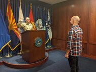 SAN DIEGO – Huntington Beach Recruiting Company Commander Capt. Jake Taeckens, podium, swears in his brother, Josh on March 19, 2020 at the San Diego Military Entrance and Processing Facility, while maintaining safe social distance. The Taeckens’ became brothers-in-arms during one of the final days of San Diego MEPS operations, prior to U.S. Army Recruiters switching to all-online recruiting efforts. For more information on Army Careers available during the COVID-19 outbreak, text: ALA0 to GOARMY (462769).