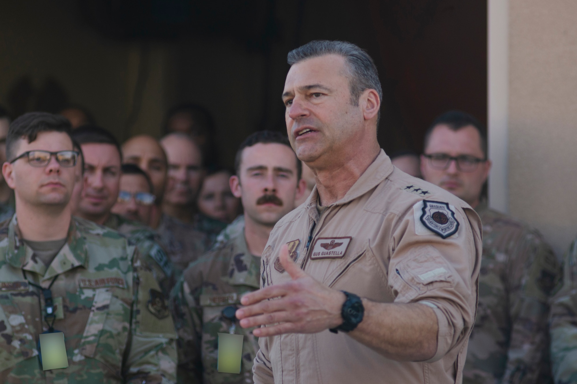 U.S. Air Force Lt. Gen. Joseph Guastella, U.S. Air Forces Central Command Commander, speaks with AFCENT Airmen outside of the combined air operations center at Al Udeid Air Base, Qatar, March 6, 2020.