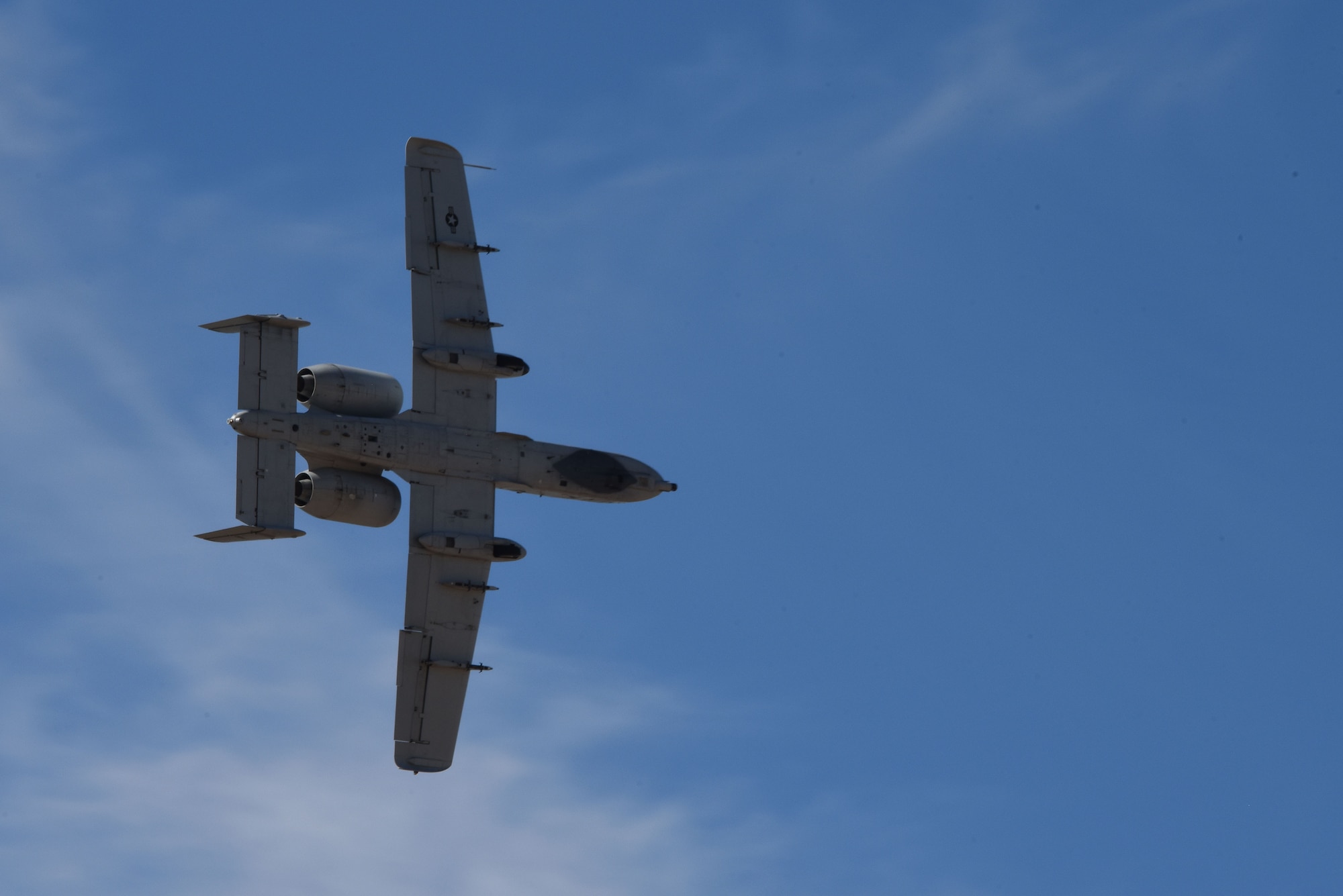 A photo of a plane flying over DM