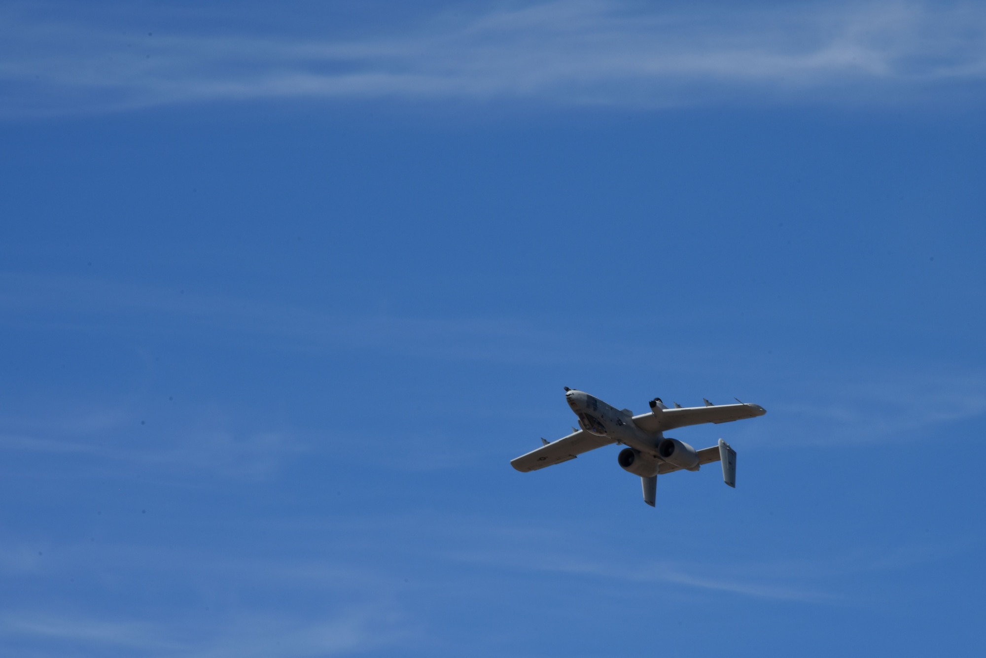 A photo of a plane flying over DM