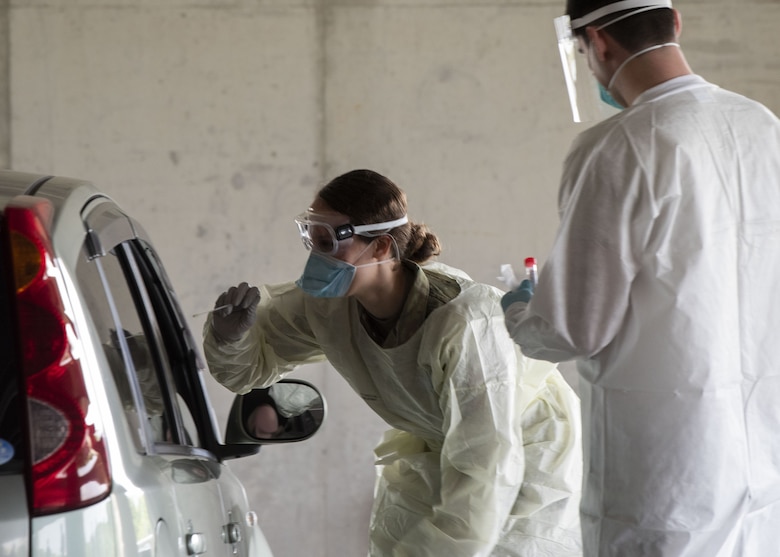 Airmen from the 18th Medical Group conduct COVID-19 testing at Kadena Air Base, Japan, March 20. Under the most current guidance from the Centers for Disease Control, the 18 MDG has increased its testing for the disease.