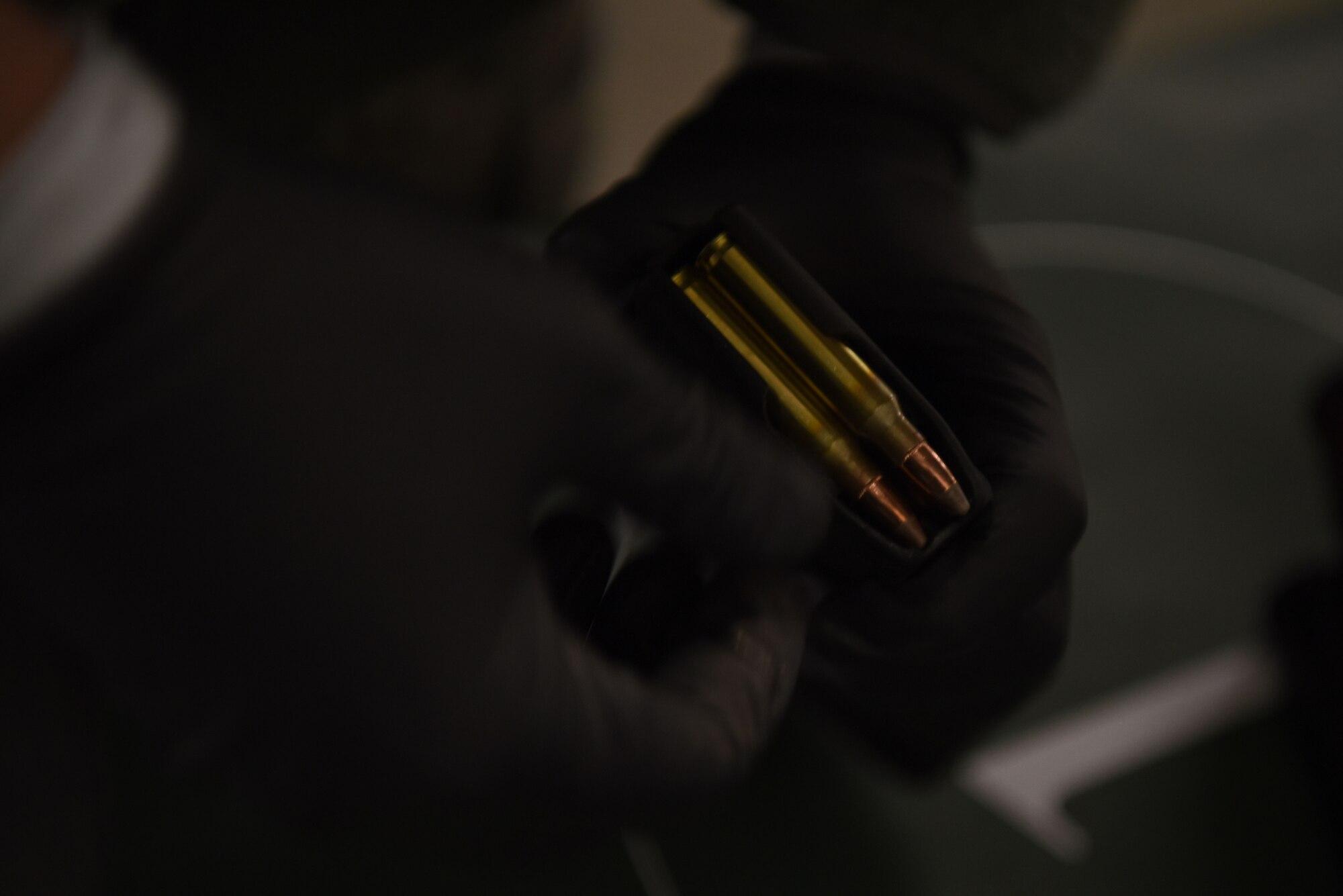 U.S. Air Force Senior Airman Roberto Umipeg, 86th Logistics Readiness Squadron fuel distributor operator, loads ammunition into an M4 carbine cartridge during a Combat Arms Training and Maintenance course.