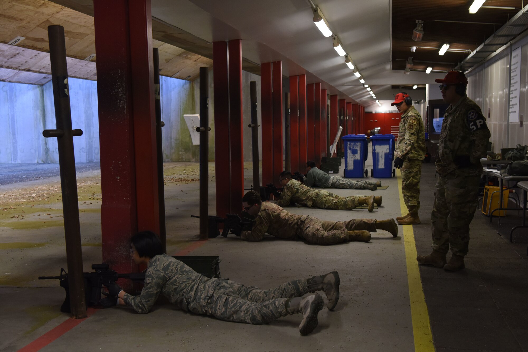 U.S. Airmen lay prone on a shooting range during a Combat Arms Training and Maintenance course.