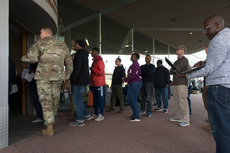 A picture of passengers waiting to enter the Passenger Terminal.
