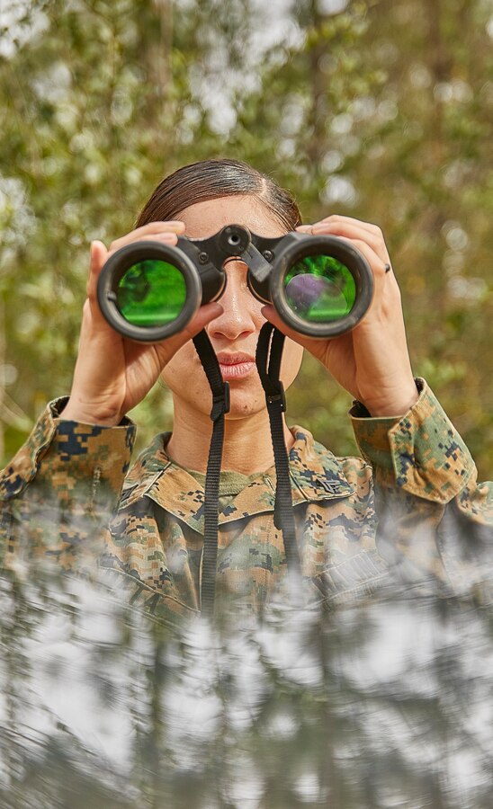 Cpl. Stephanie Mata an administration specialist with Marine Transport Squadron Belle Chasse, looks for possible improvised explosive devices as part of a simulated event during a field exercise at Camp Villere, Slidell, Louisiana, March 12, 2020. The field exercise incorporated activities that provided guidance for a Basic Skills Test to ensure all Marines sustain basic combat skills and knowledge to be successful on the battlefield. (Marine Corps photo by Lance Cpl. Leslie Alcaraz)