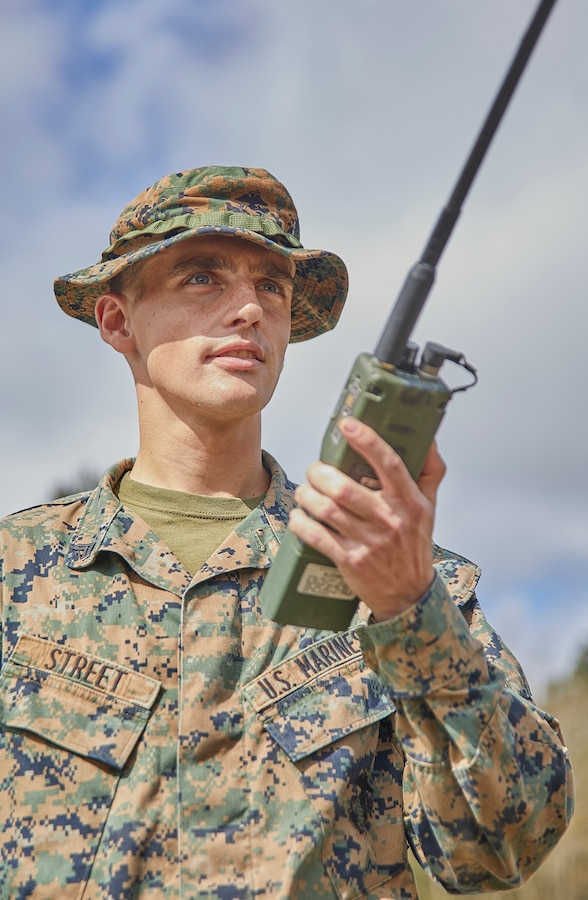 Cpl. Cameron Street, a musician with Marine Forces Reserve Band, radios in a nine line medical evacuation request as part of a simulated activity during a field exercise at Camp Villere, Slidell, Louisiana, March 12, 2020. The field exercise incorporated activities that provided guidance for a Basic Skills Test to ensure all Marines sustain basic combat skills and knowledge to be successful on the battlefield. (Marine Corps photo by Lance Cpl. Leslie Alcaraz)