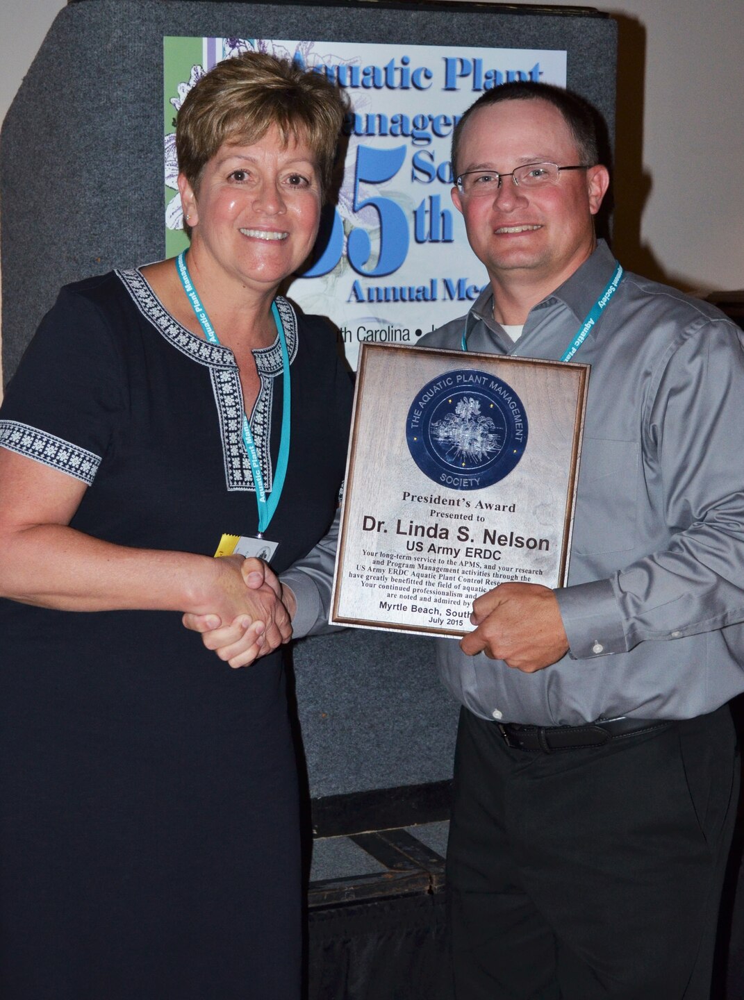 Dr. Cody Gray congratulates Dr. Linda Nelson as she receives the President’s Award from the Aquatic Plant Management Society in 2015 for her dedication to the organization over the course of her career. Nelson retired from the U.S. Army Engineer Research and Development Center’s Environmental Laboratory, February 28, 2020, wearing three hats: associate technical director for Civil Works, Environmental Engineering and Sciences, and program manager for the Aquatic Nuisance Species Research and the Aquatic Plant Control Research Programs.