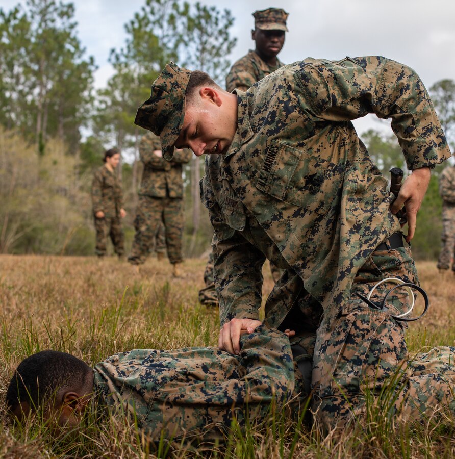 Sgt. Brian Harris, an intelligence analyst with Marine Forces Reserve, practices Detainee Handling during a field exercise, at Camp Villere, Slidell, Louisiana, March 11, 2020. Marines annually work to sustain skills critical to winning our nation’s battles, regardless of rank or occupation. (U.S. Marine Corps photo by Lance Cpl. Colby Bundy)