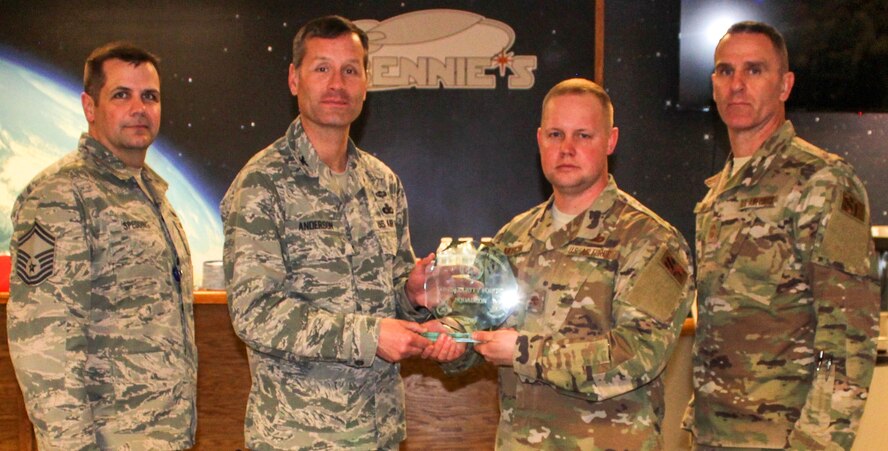 The 50th Security Forces Squadron earned the outstanding medium SFS award March 12, 2020 at Schriever Air Force Base, Colorado during an award ceremony at Bennie’s. One of the several achievements by the 50th SFS included increasing engagement for the 50th Network Operations Group. From left are Senior Master Sgt. Jason Spedding, 50th Security Forces Squadron operations manager, Col. Gregory Anderson, United States Space Force SFS division chief, Maj. Adam Morgan, 50th SFS commander and Chief Master Sgt. Russell Louk, USSF SFS manager. (U.S. Air Force photo by Marcus Hill)